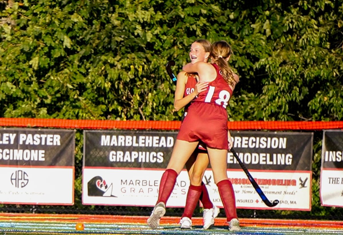 Isla Black (18) hugs sister Fiona Black after the latter's first Varsity goal.